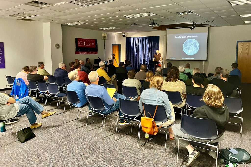 MAS members sitting at a meeting, listening to a guest speaker